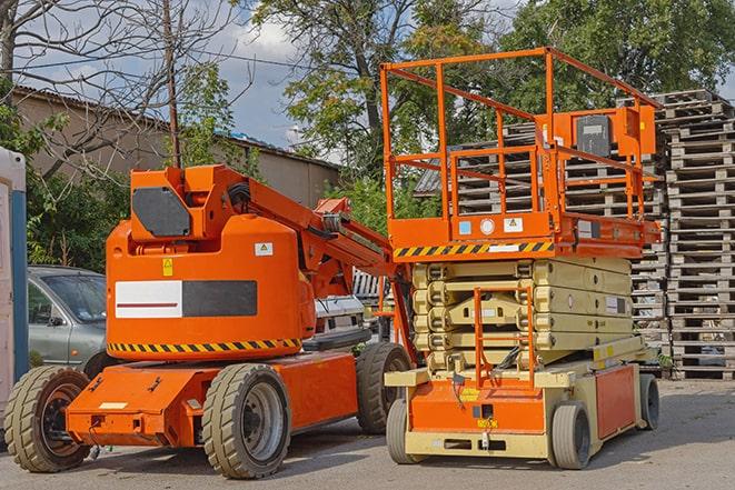 forklift maneuvering through a warehouse with stocked shelves in Bloomer, WI